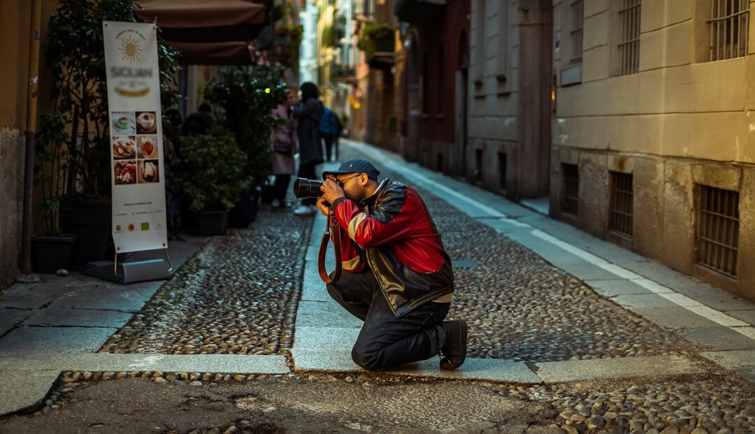 Photographer capturing images on a city street