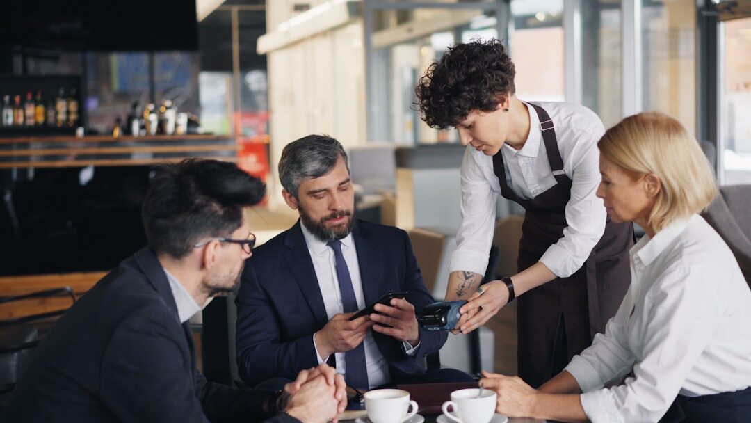 Team of professionals discussing content around a table